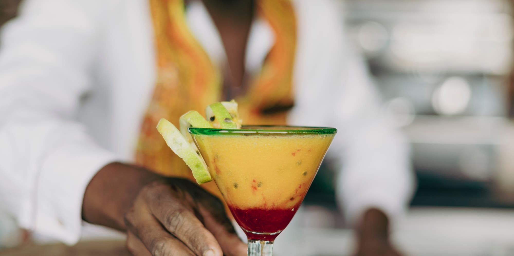 a man holding a drink