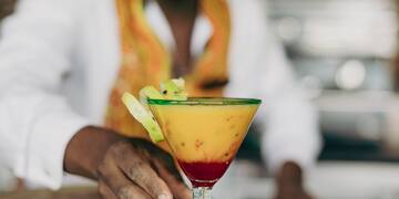 a man holding a drink