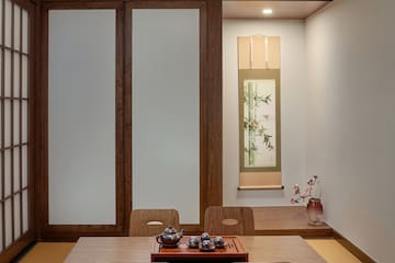 a room with a table and chairs