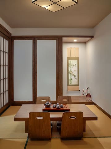 a room with a table and chairs