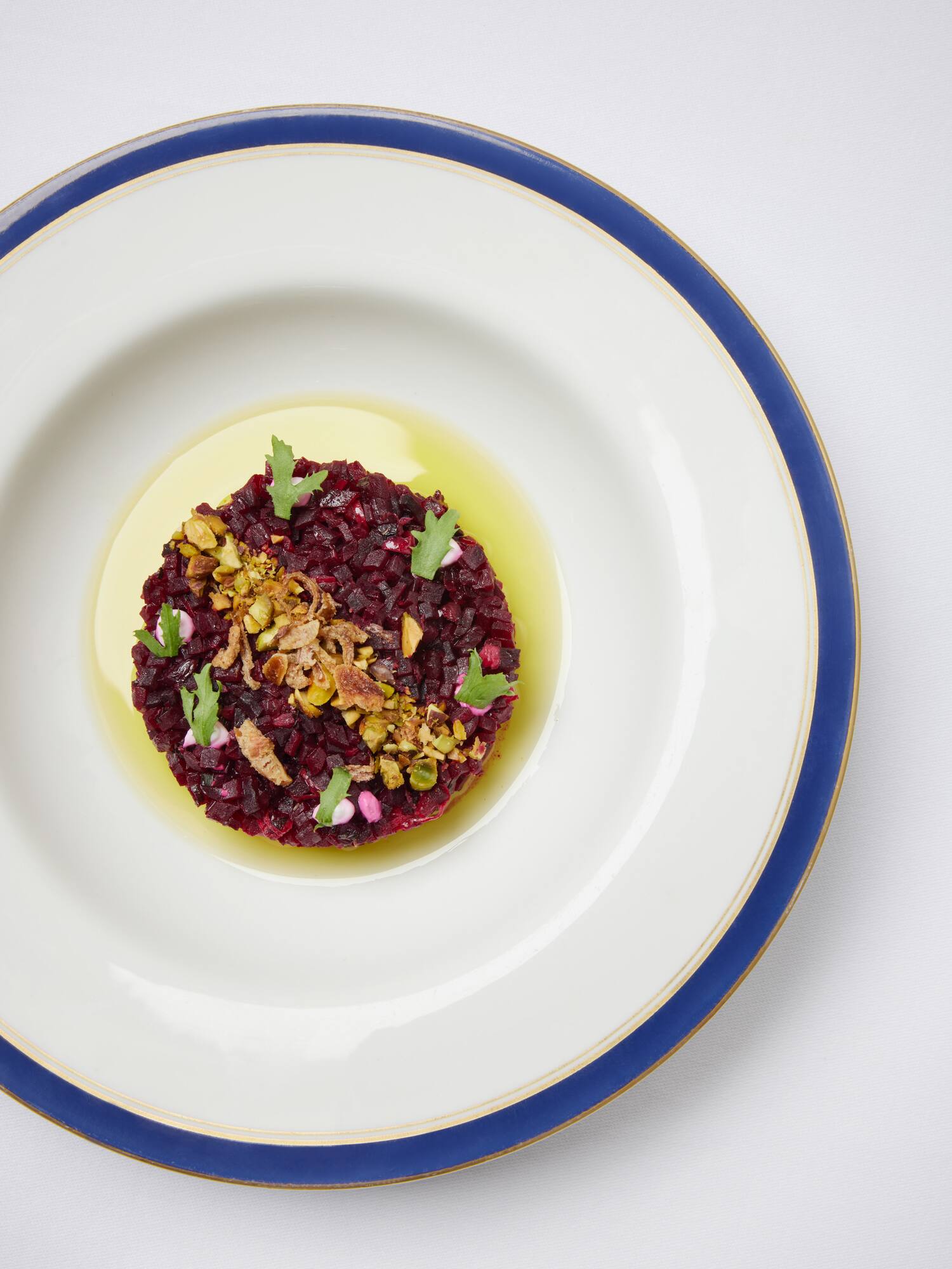 a plate of food on a white surface