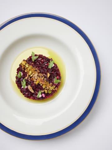 a plate of food on a white surface