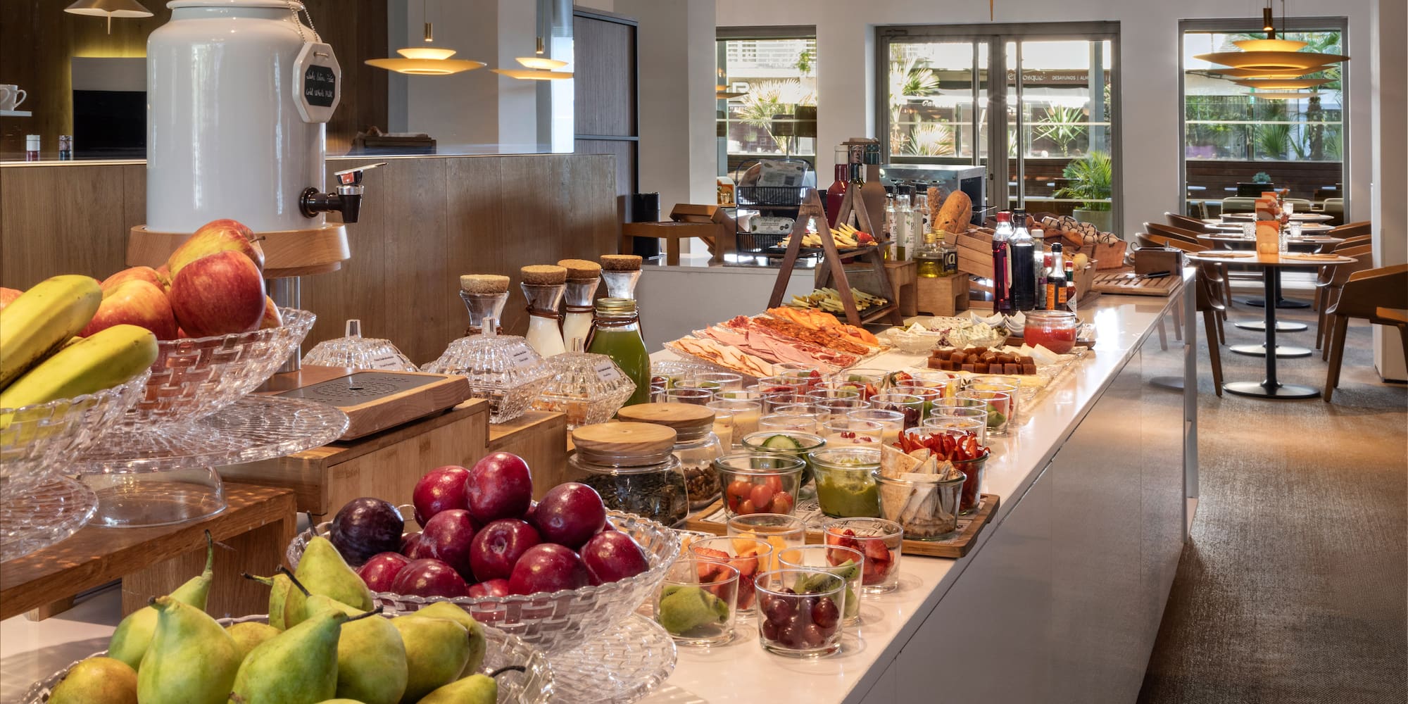 a counter with fruit and vegetables on it