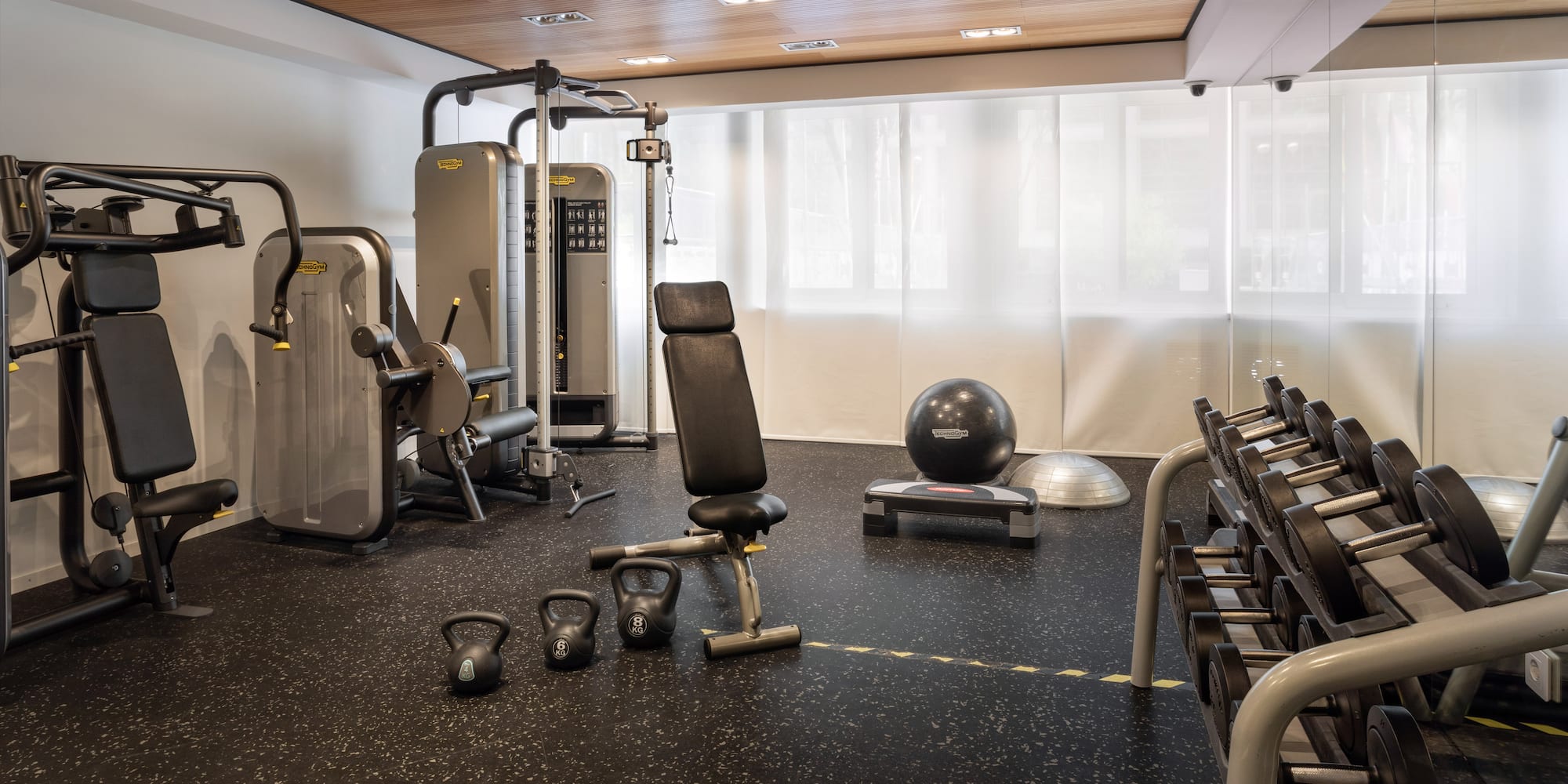 a gym with weights and exercise equipment
