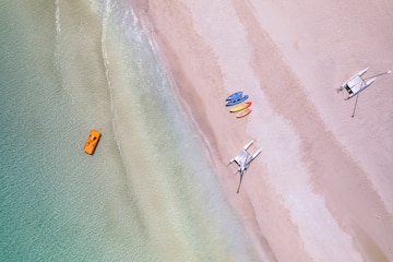 a beach with boats and a boat on the beach
