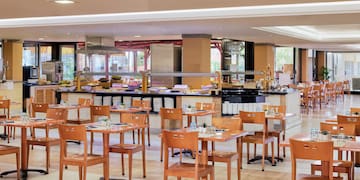 a restaurant with tables and chairs
