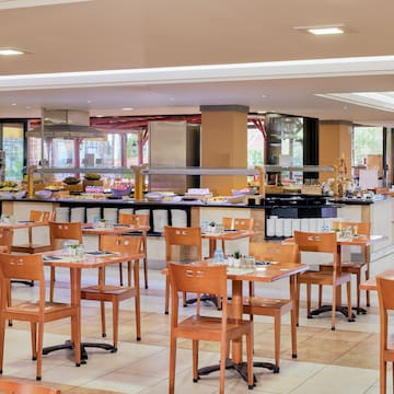 a restaurant with tables and chairs