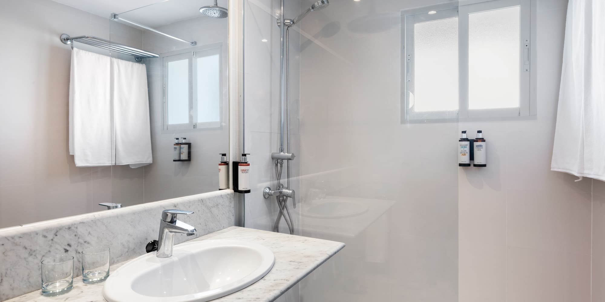 a bathroom with a shower and sink