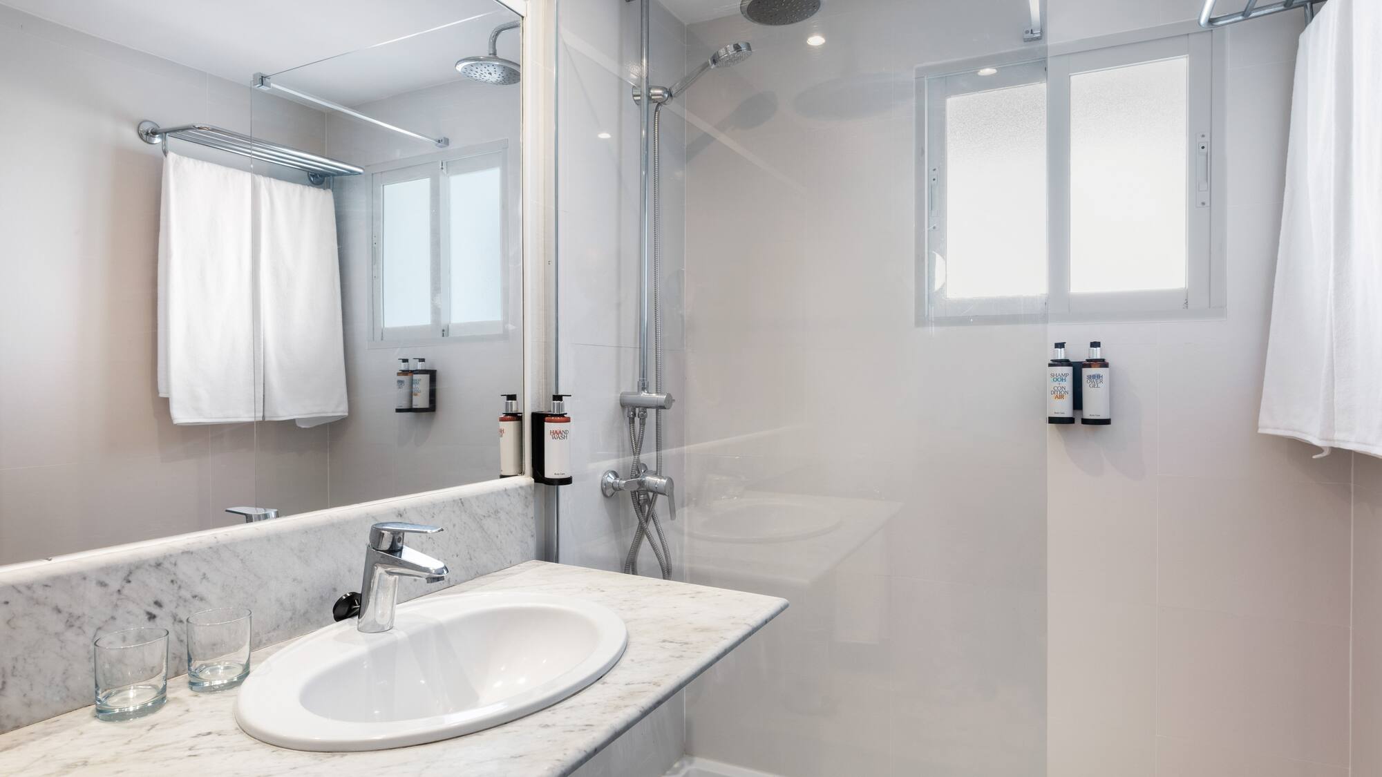 a bathroom with a shower and sink