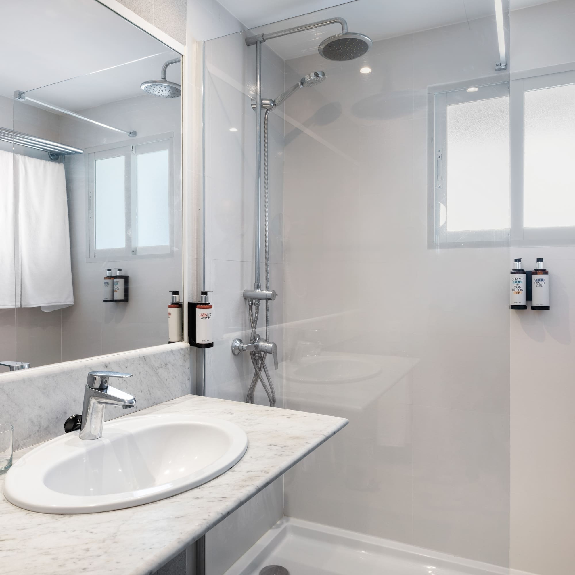 a bathroom with a shower and sink