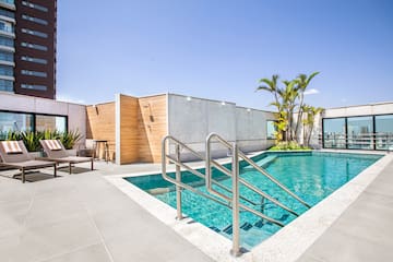 a swimming pool with a metal railing