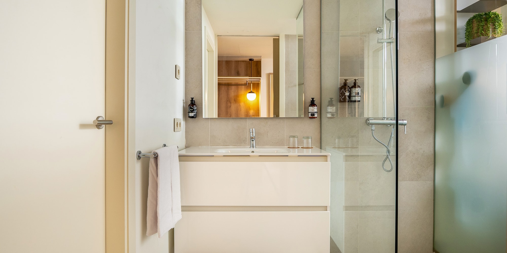 a bathroom with a shower and sink