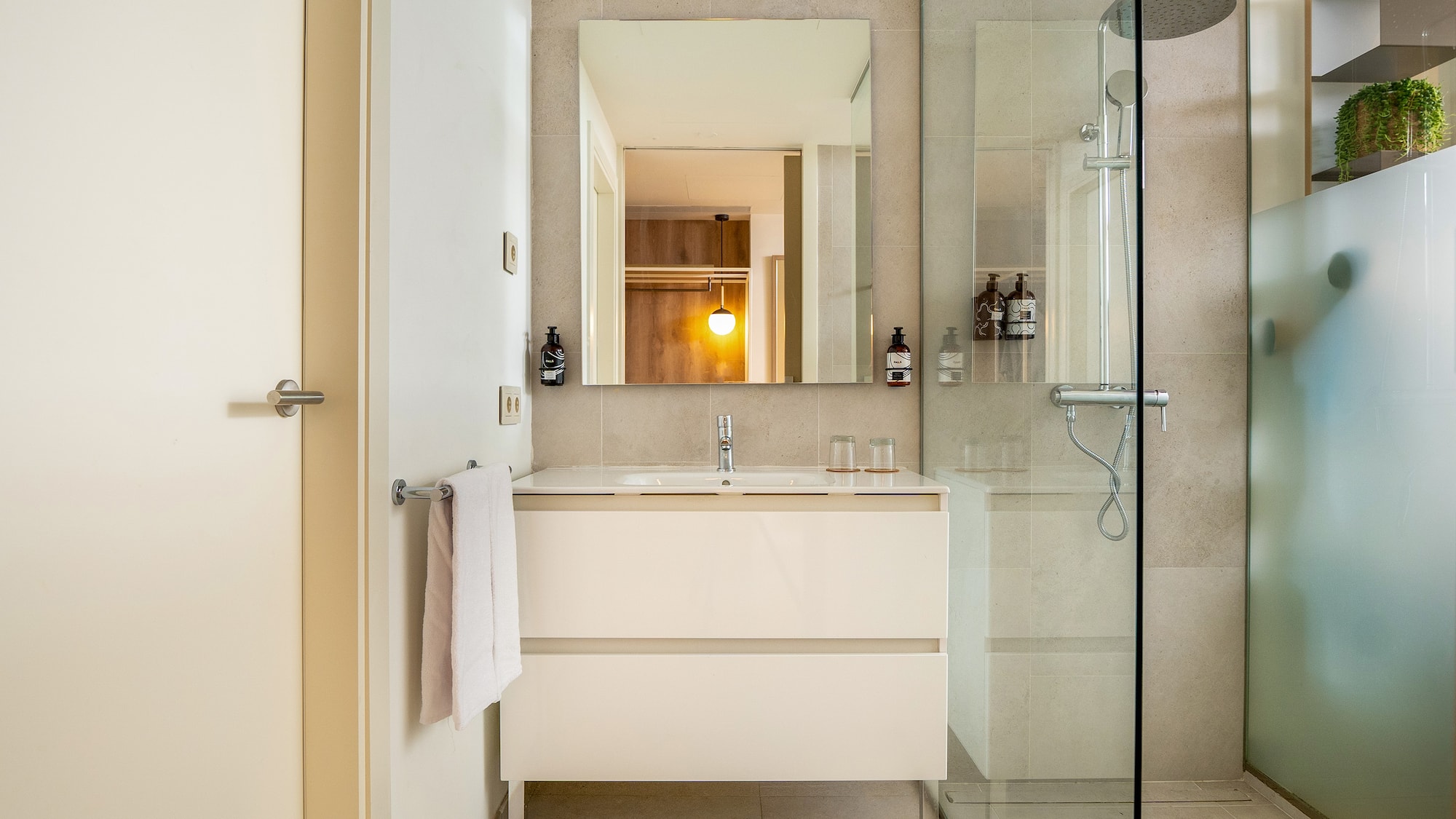 a bathroom with a shower and sink
