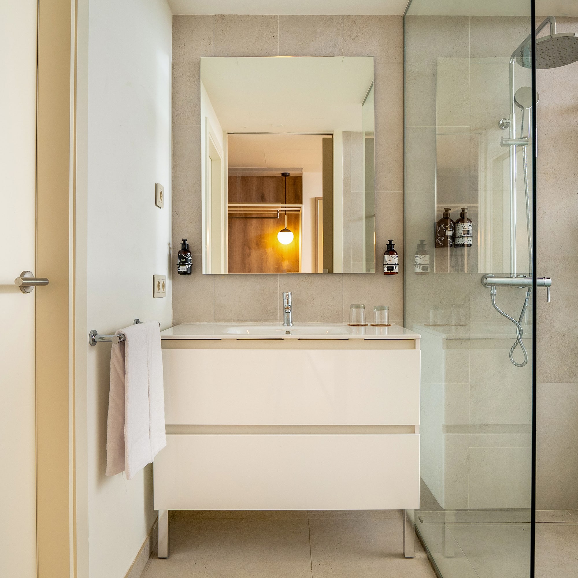 a bathroom with a shower and sink