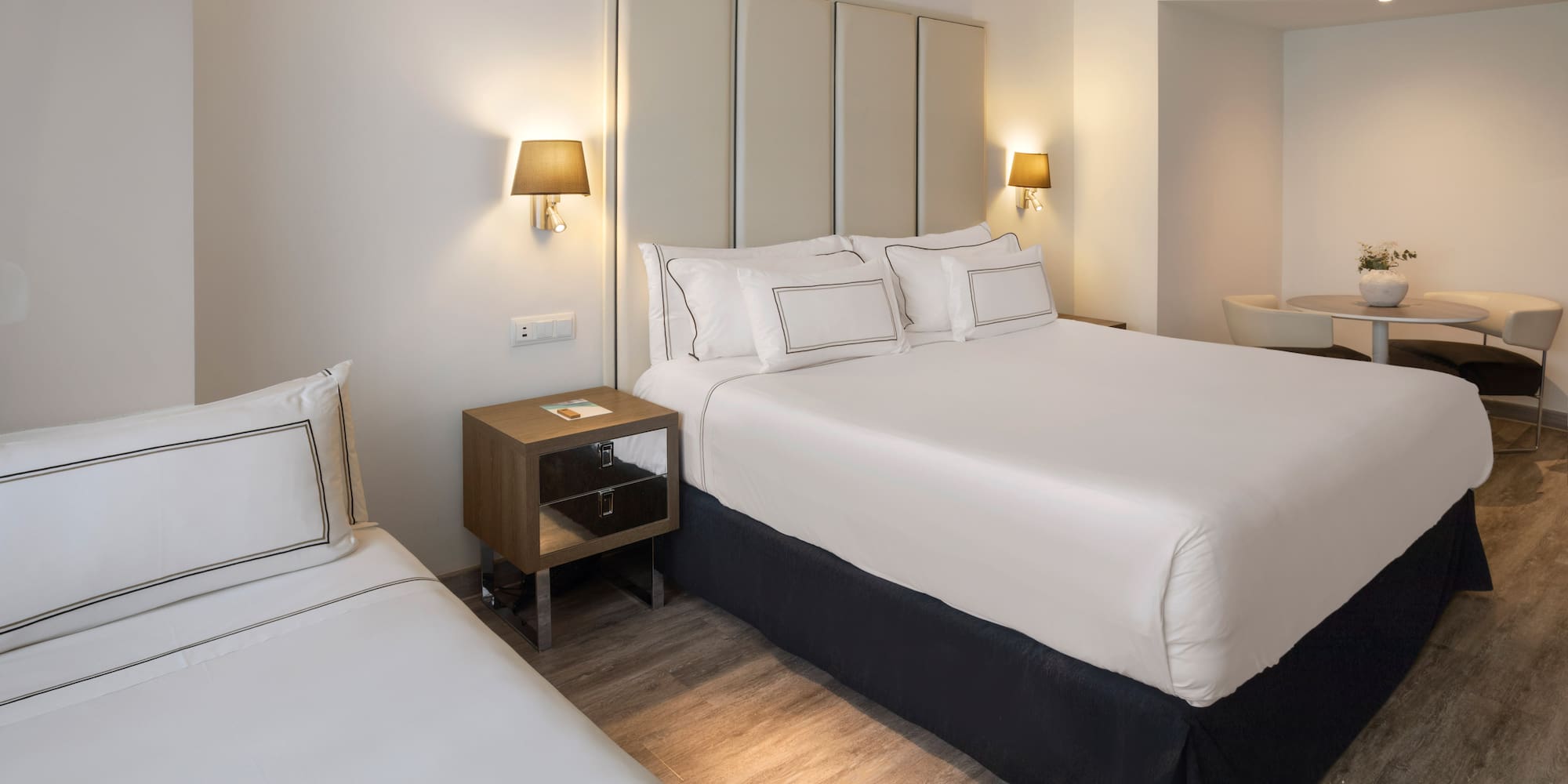 a bedroom with a bed and a sink