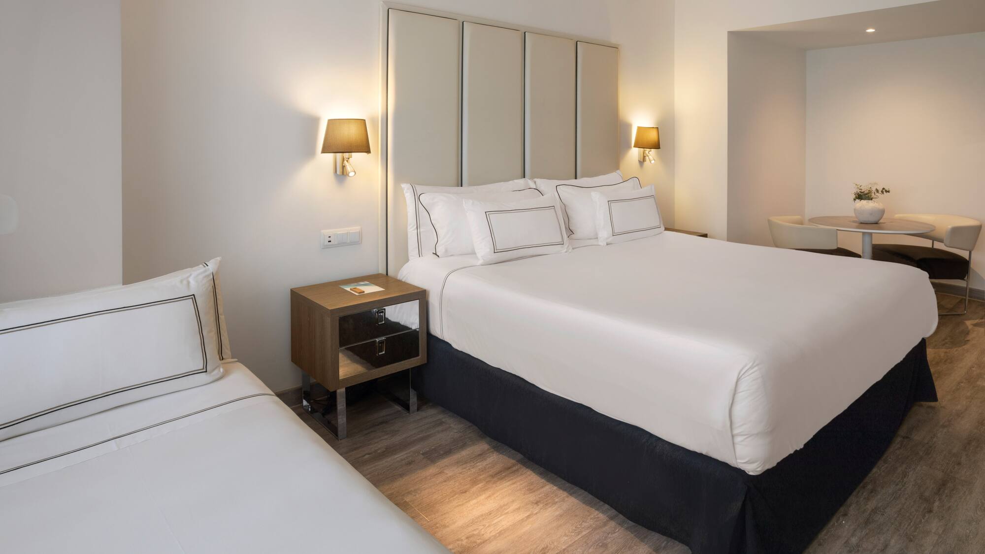 a bedroom with a bed and a sink