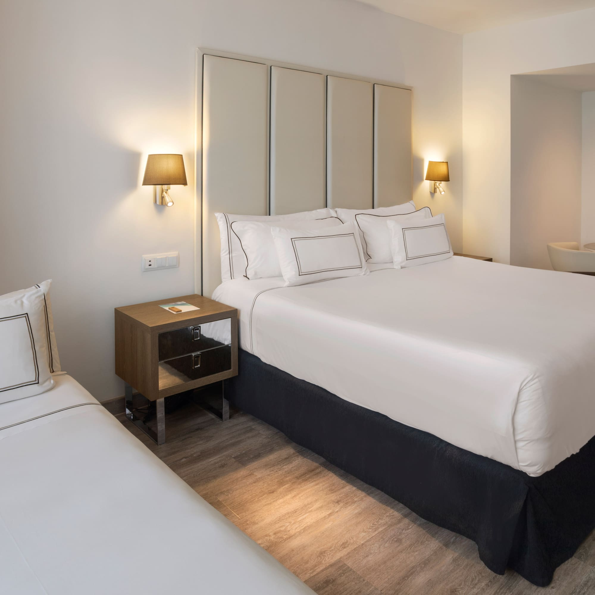 a bedroom with a bed and a sink