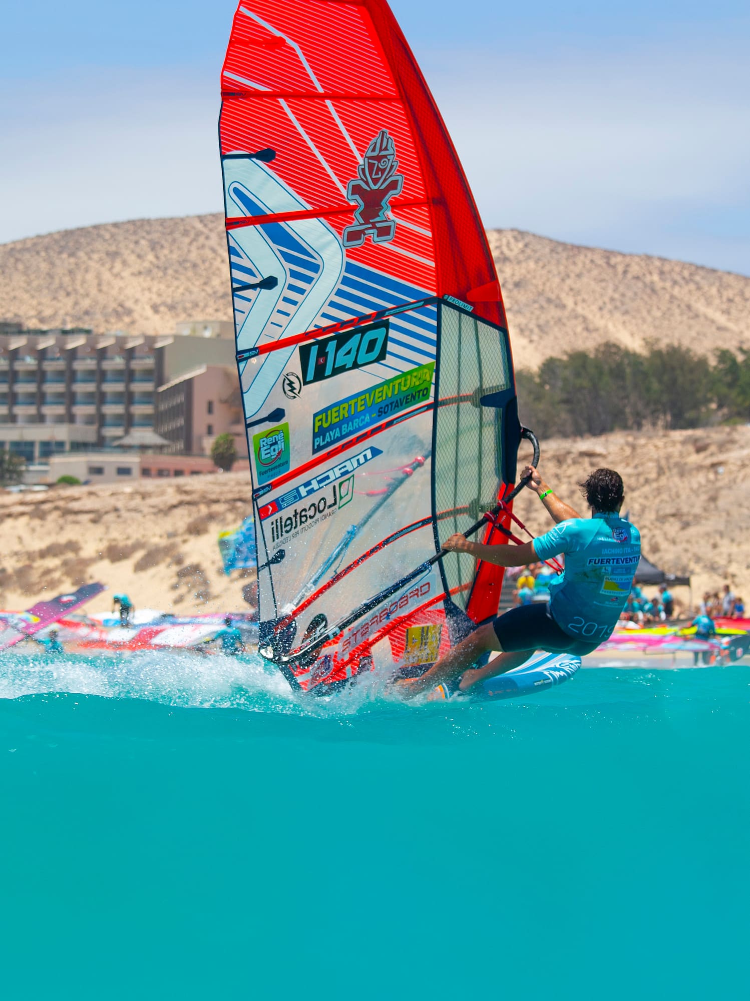 a man on a sailboat in the water