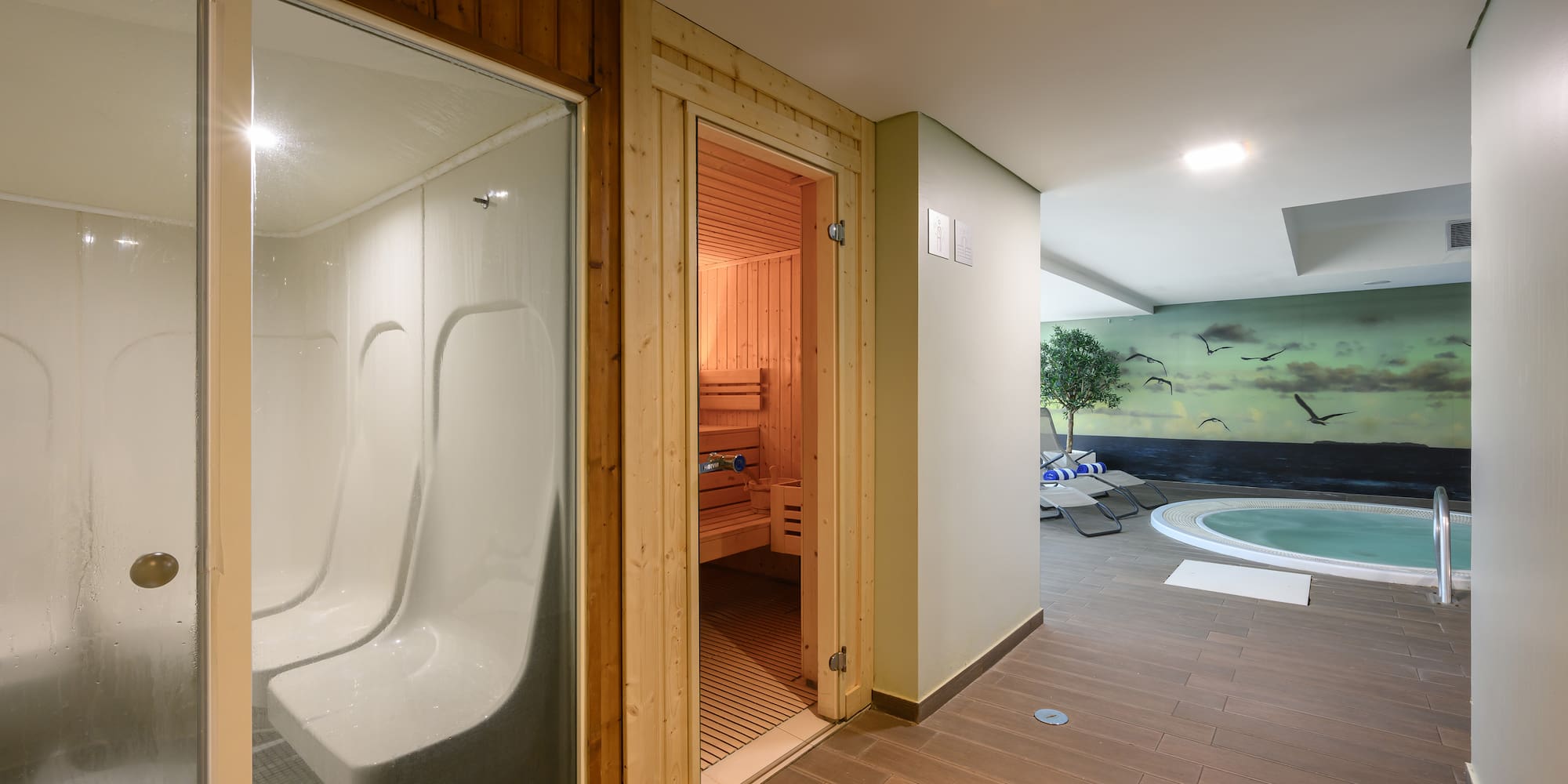 a room with a sauna and a pool