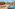 Oceanfront terrace with hot tub, sun loungers, and panoramic sea view.