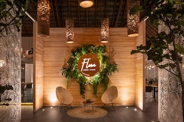 a room with a sign and chairs