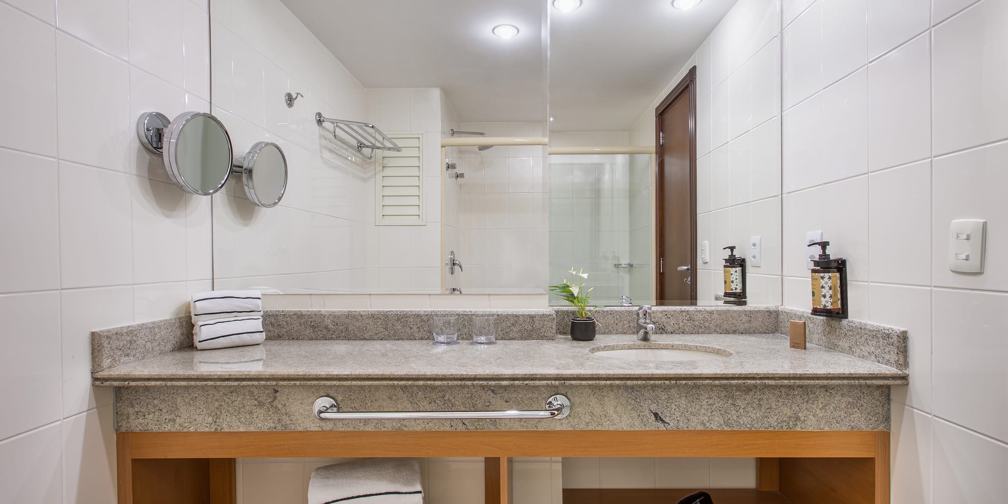 a bathroom with a sink and a blow dryer