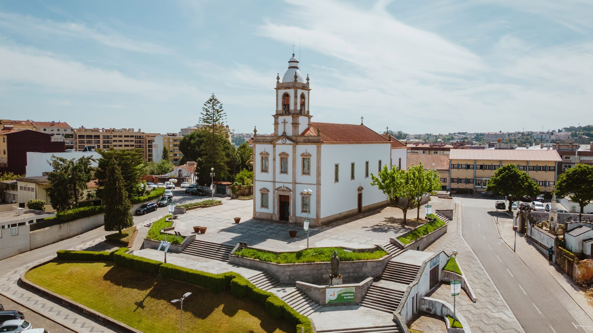 a building with a tower and a staircase in front of it