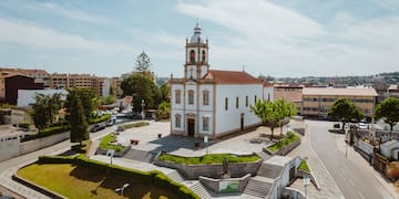a building with a tower and a staircase in front of it