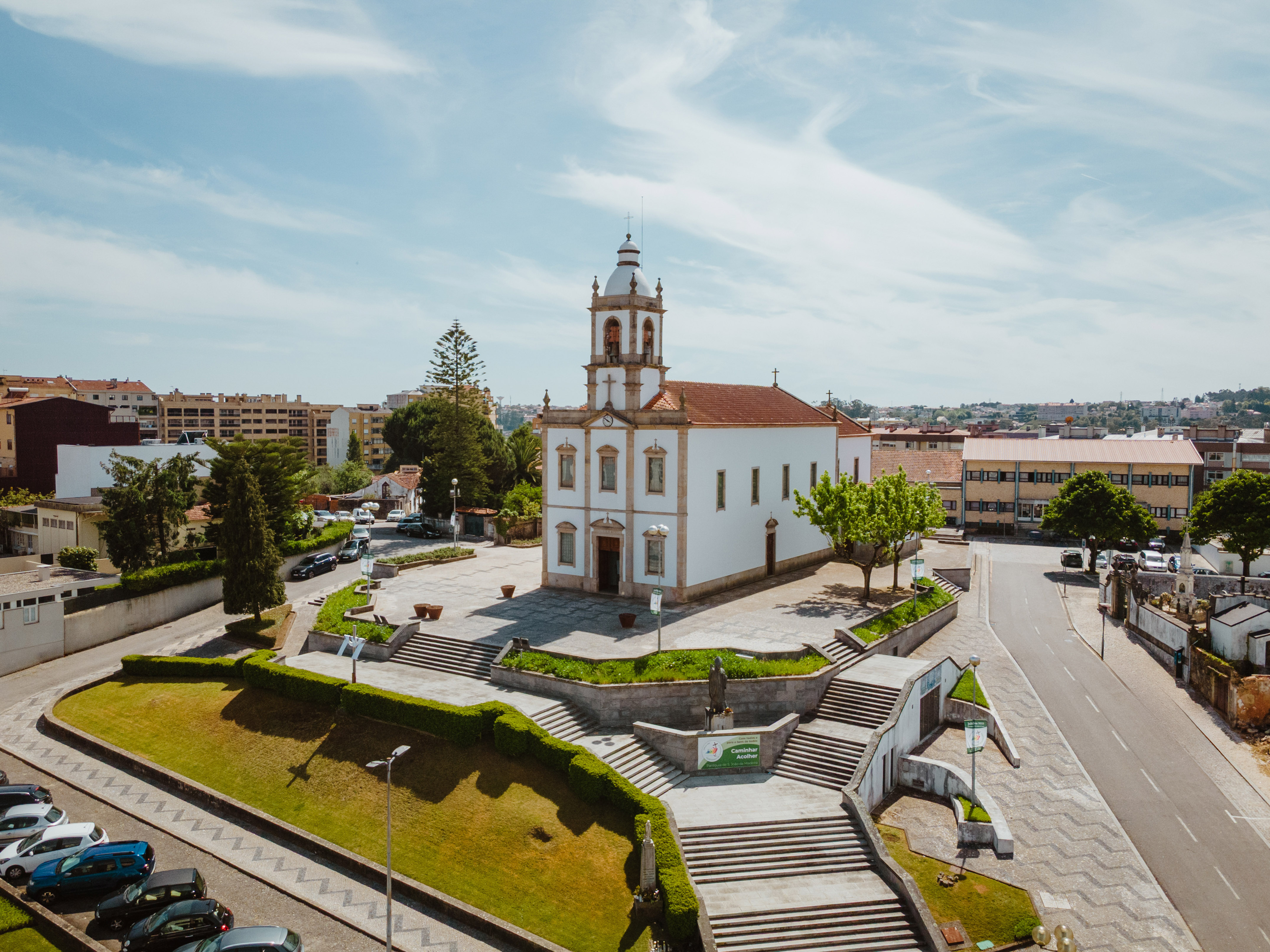 a building with a tower and a staircase in front of it