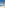 a beach with palm trees and blue water