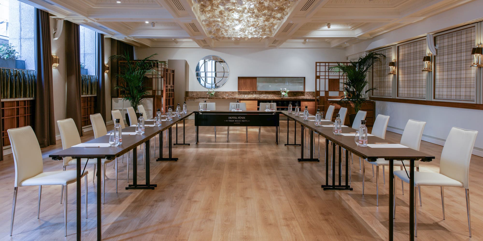 a room with long tables and chairs