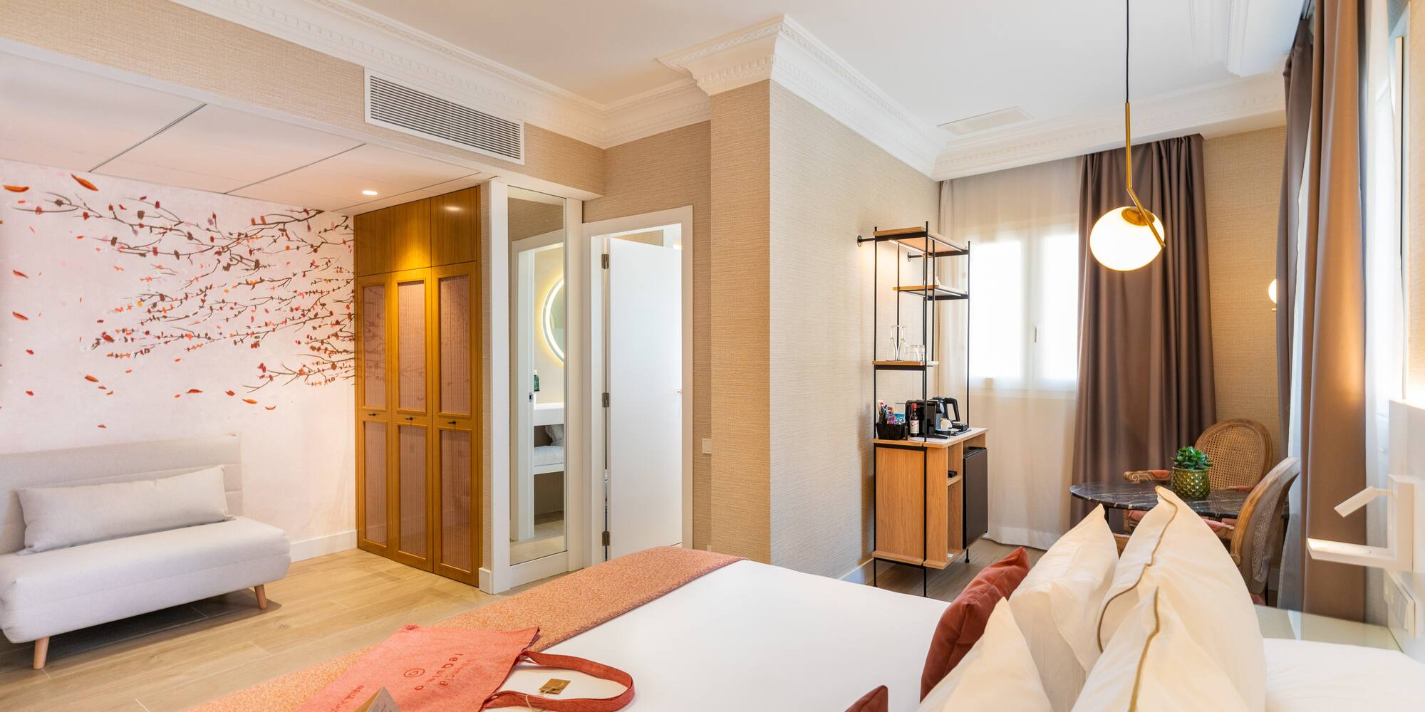 a room with a bed and a bed and a desk