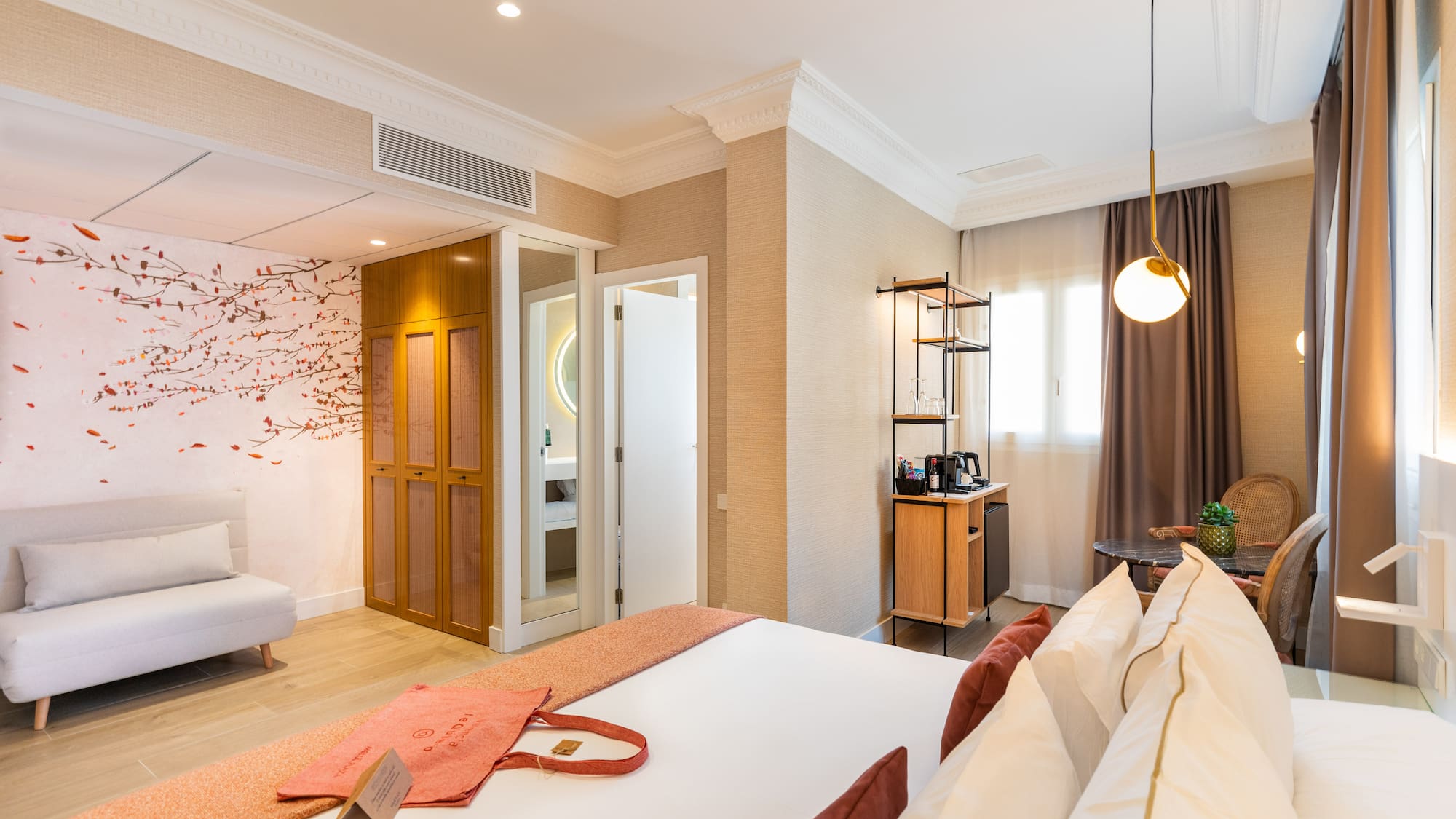 a room with a bed and a bed and a desk