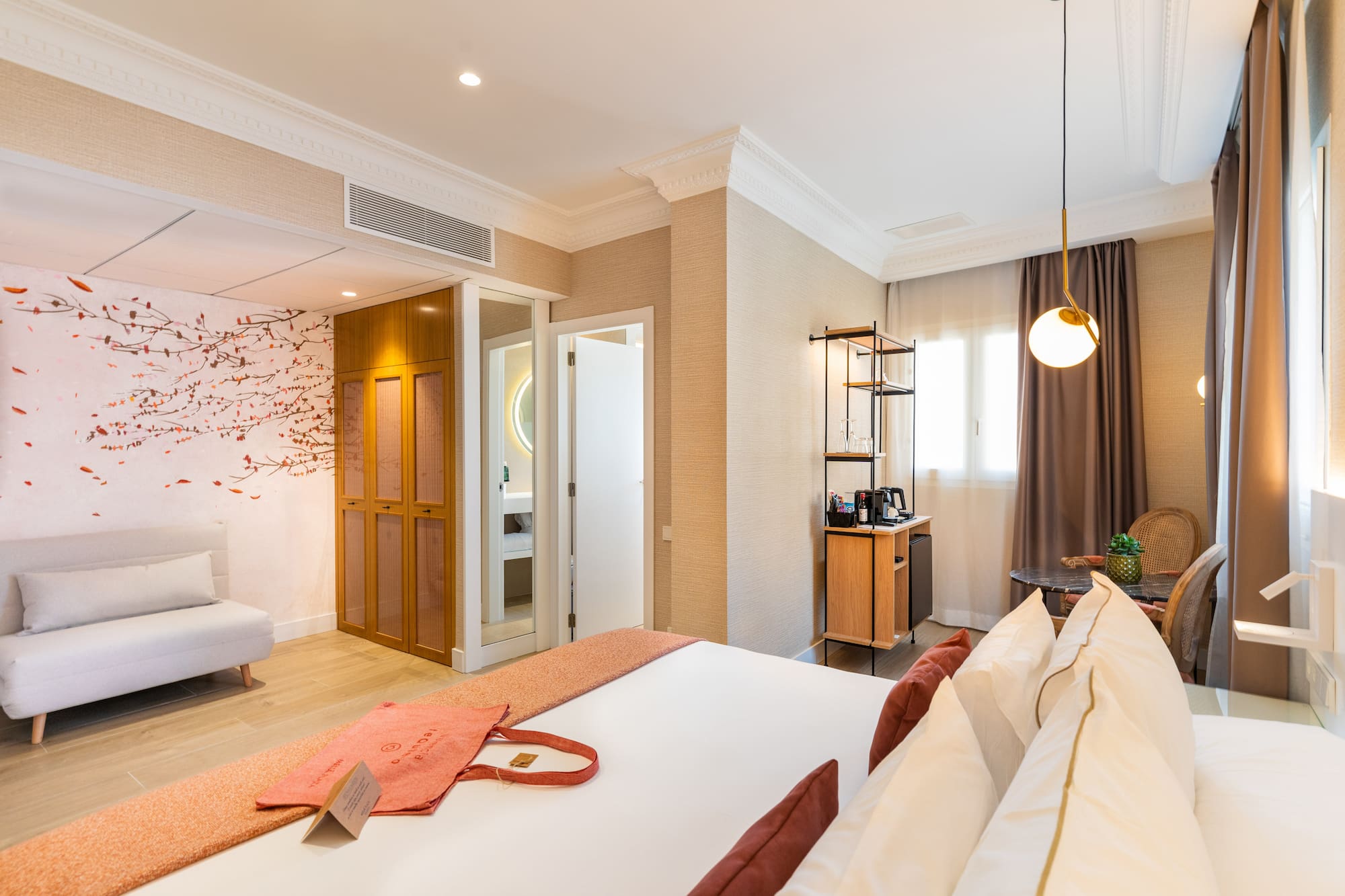 a room with a bed and a bed and a desk