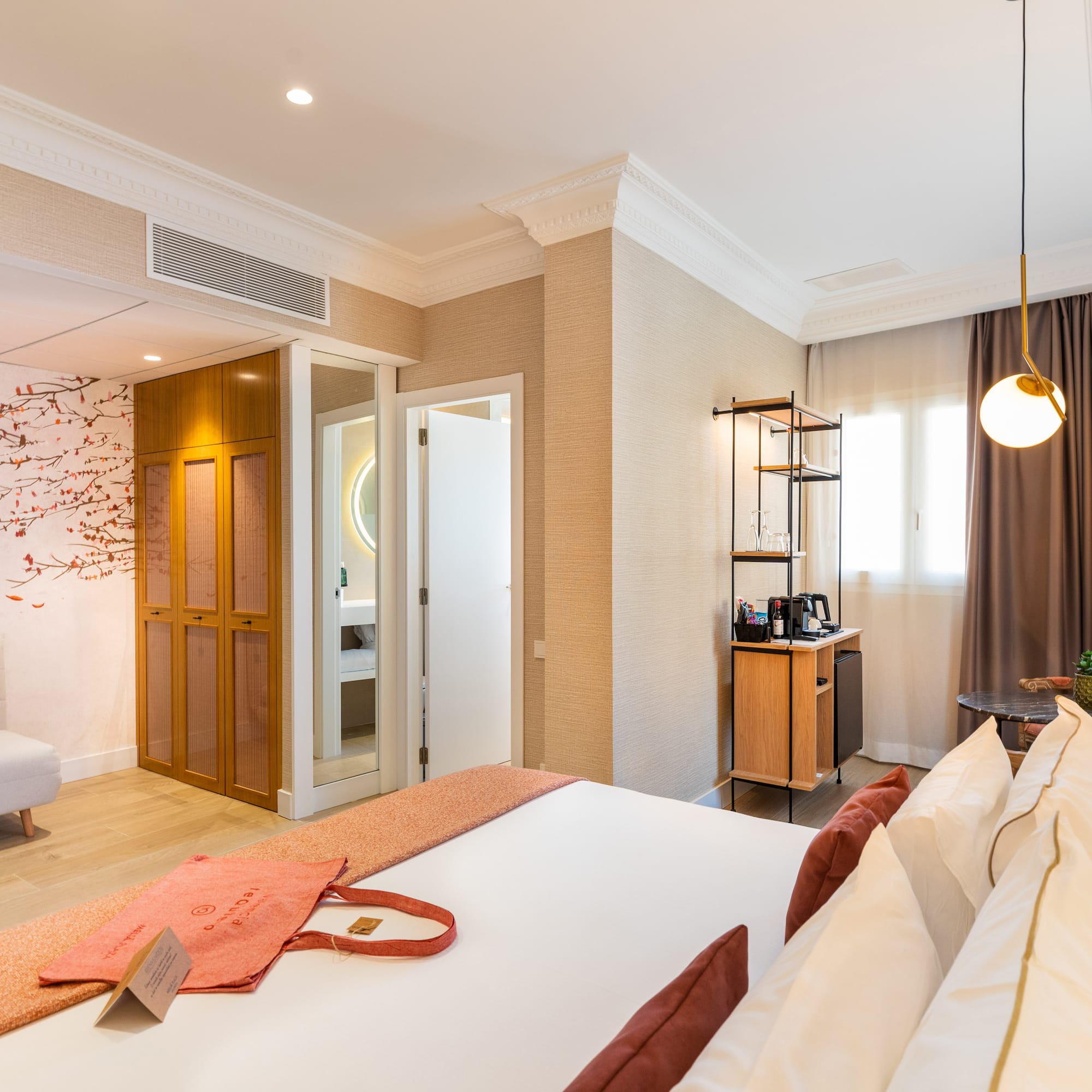 a room with a bed and a bed and a desk