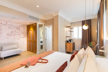 a room with a bed and a bed and a desk