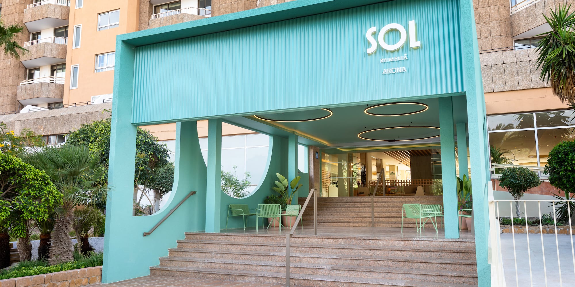 a building with stairs and a blue awning