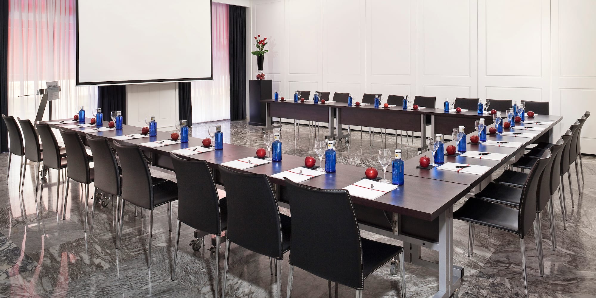 a room with a large table and chairs