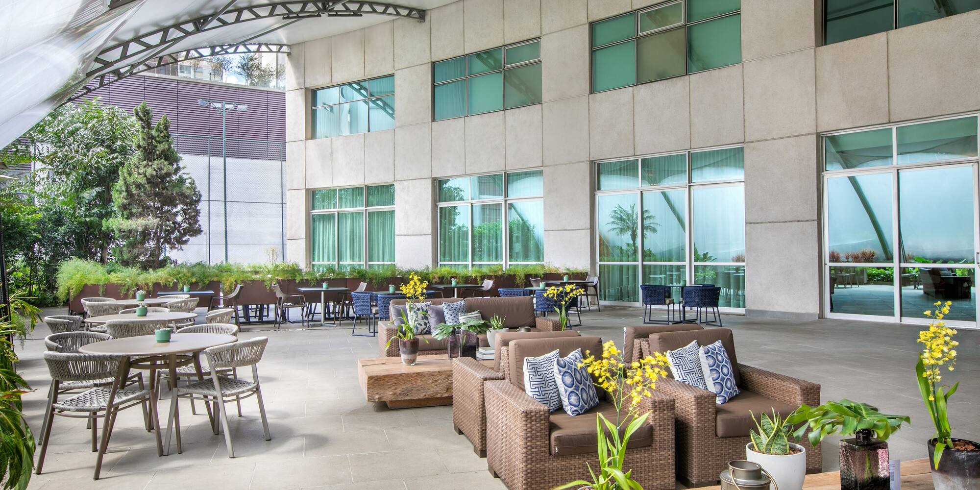 a patio area with chairs and tables