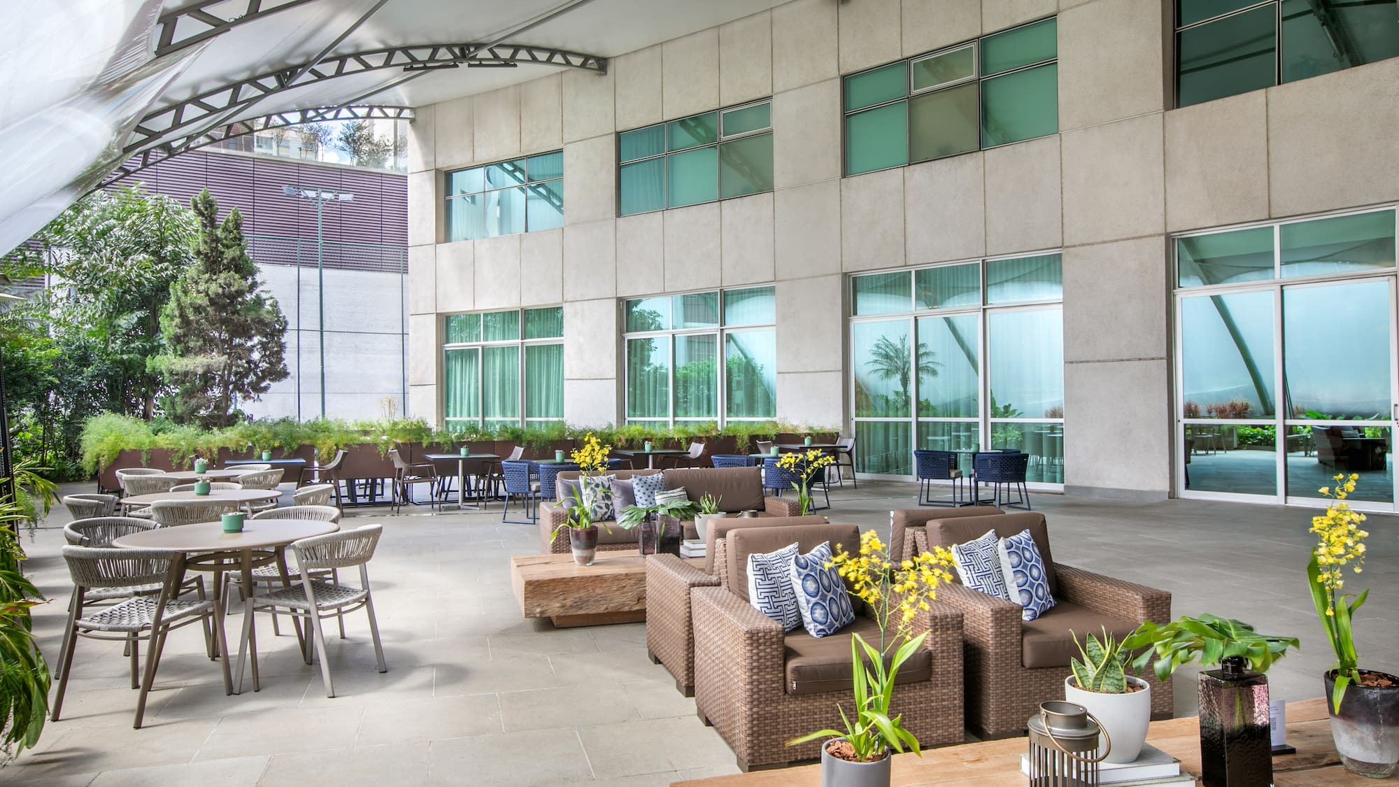 a patio area with chairs and tables