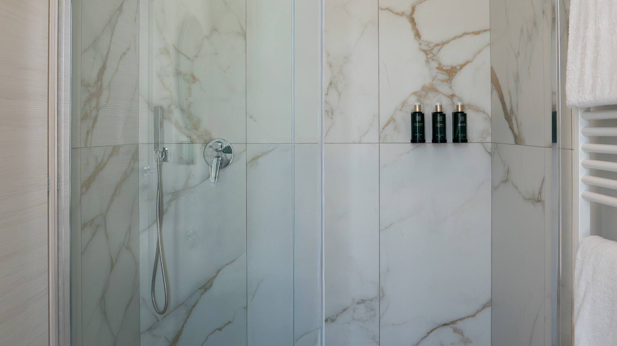 a shower with glass doors