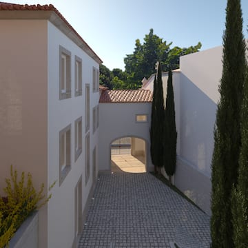 a courtyard with trees and a building