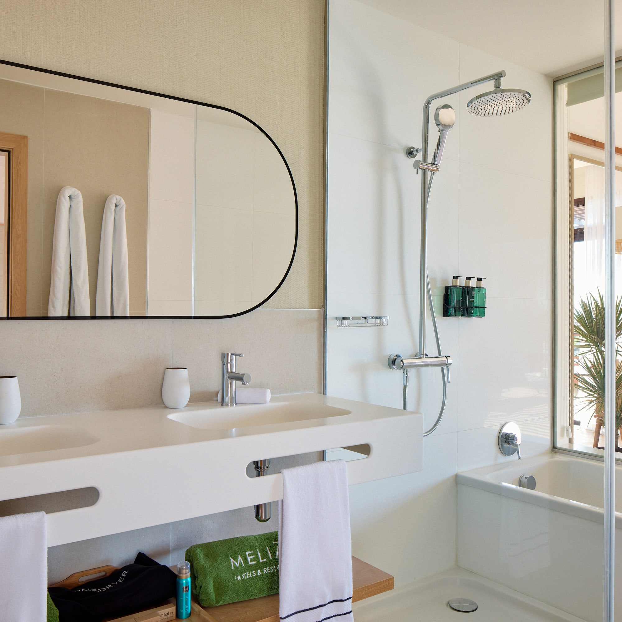 a bathroom with a shower and sink