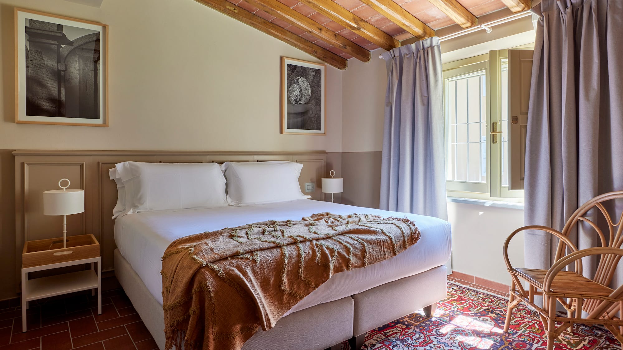 a bedroom with a bed and a chair