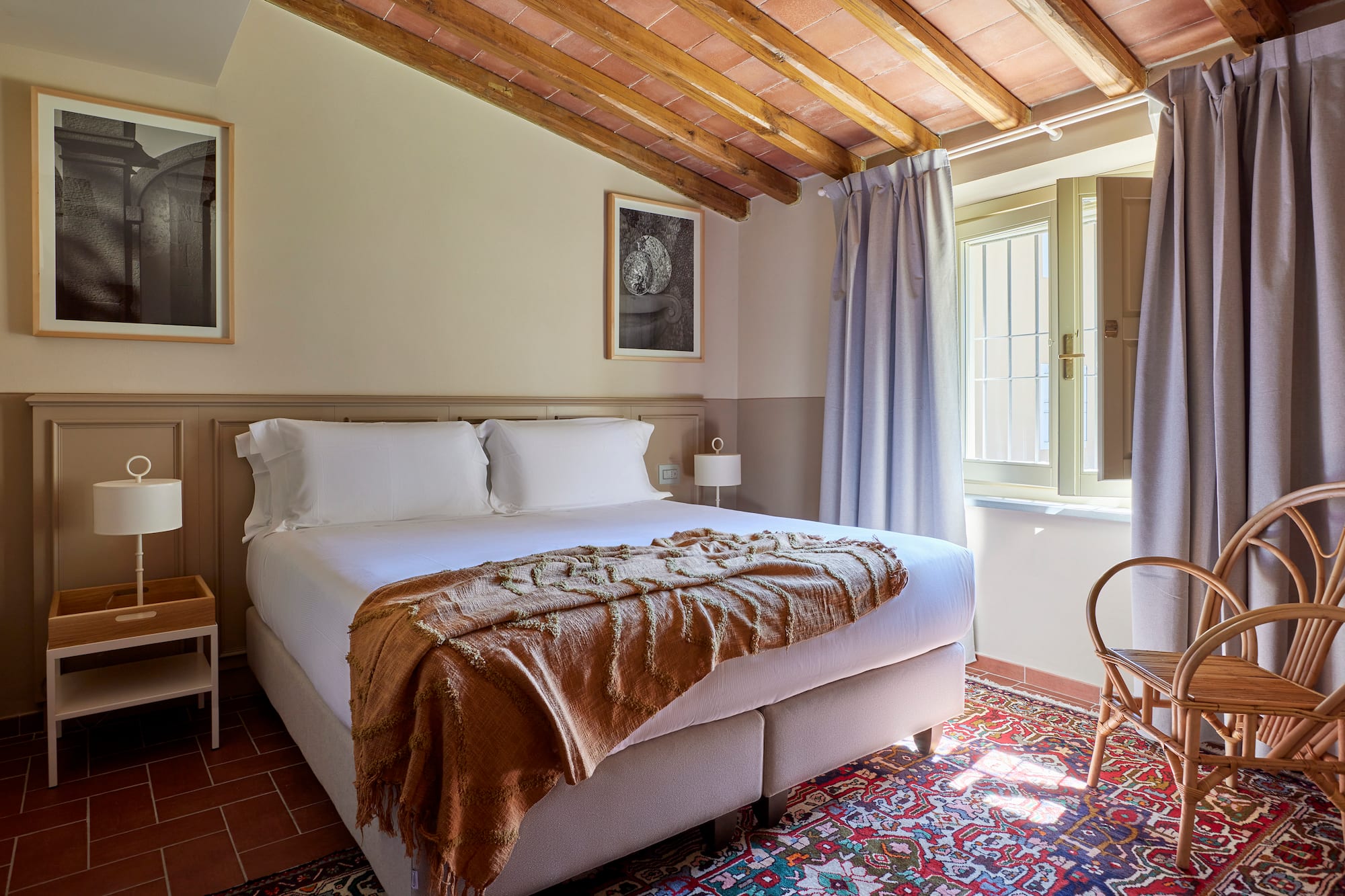 a bedroom with a bed and a chair