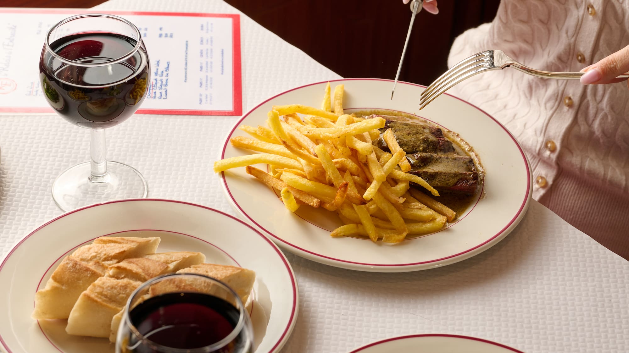 a person eating food on a table