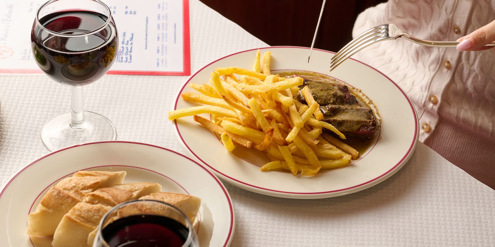 a person eating food on a table
