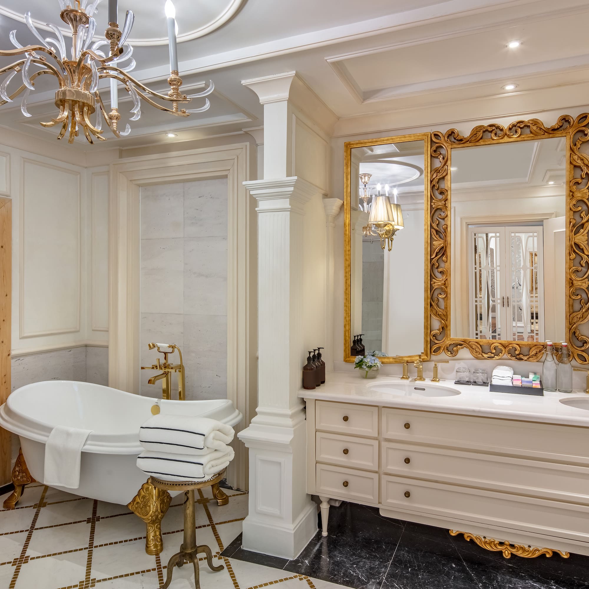 a bathroom with a large mirror and a tub