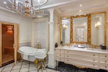 a bathroom with a large mirror and a tub