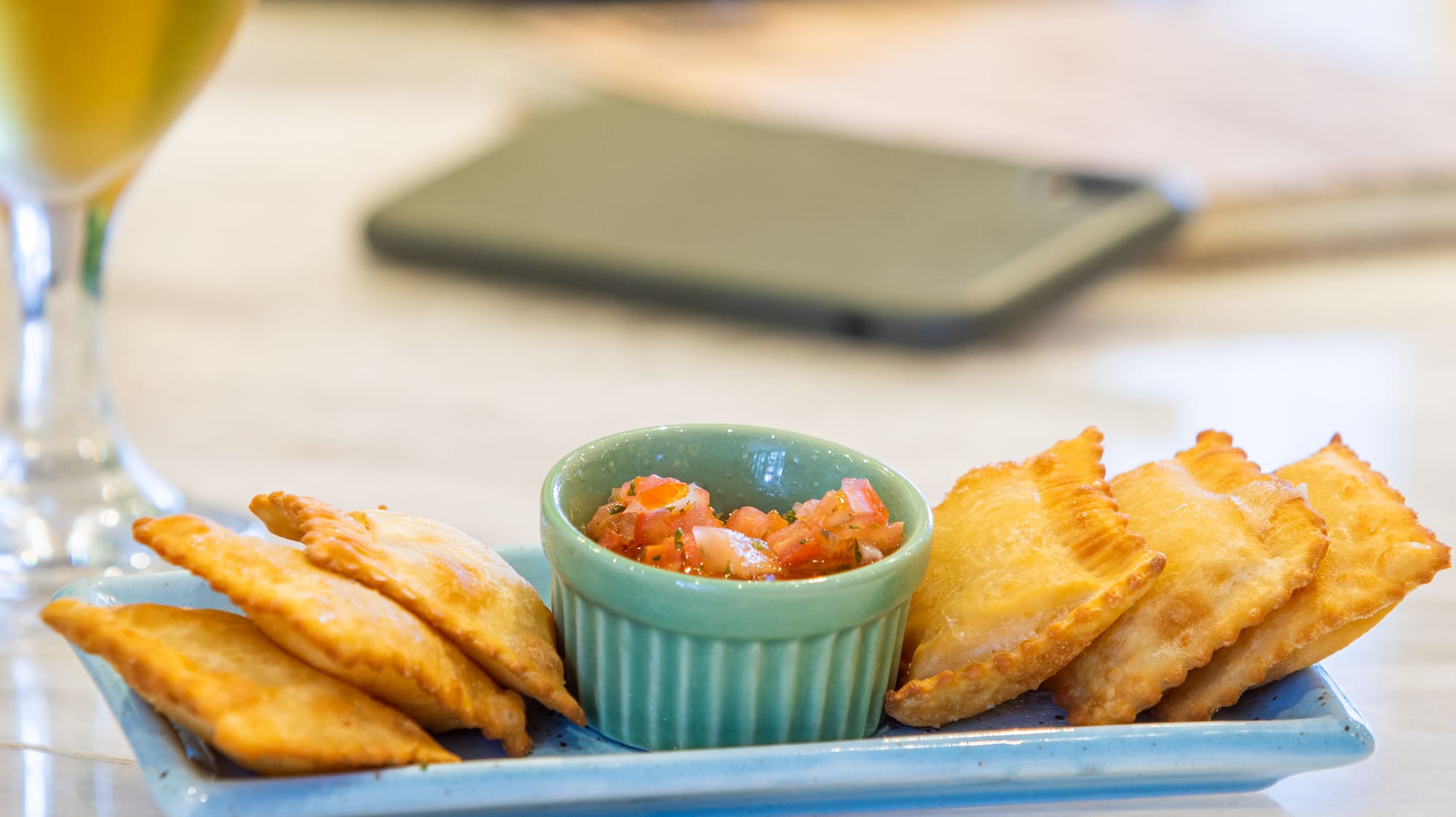 a plate of food and a glass of beer